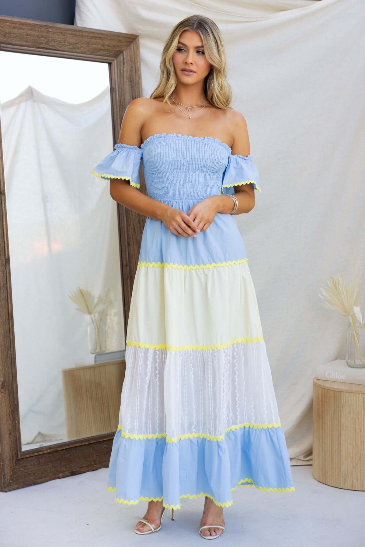 Palmer Maxi Dress in blue and white with ruffled sleeves and tiered design, perfect for summer outings.