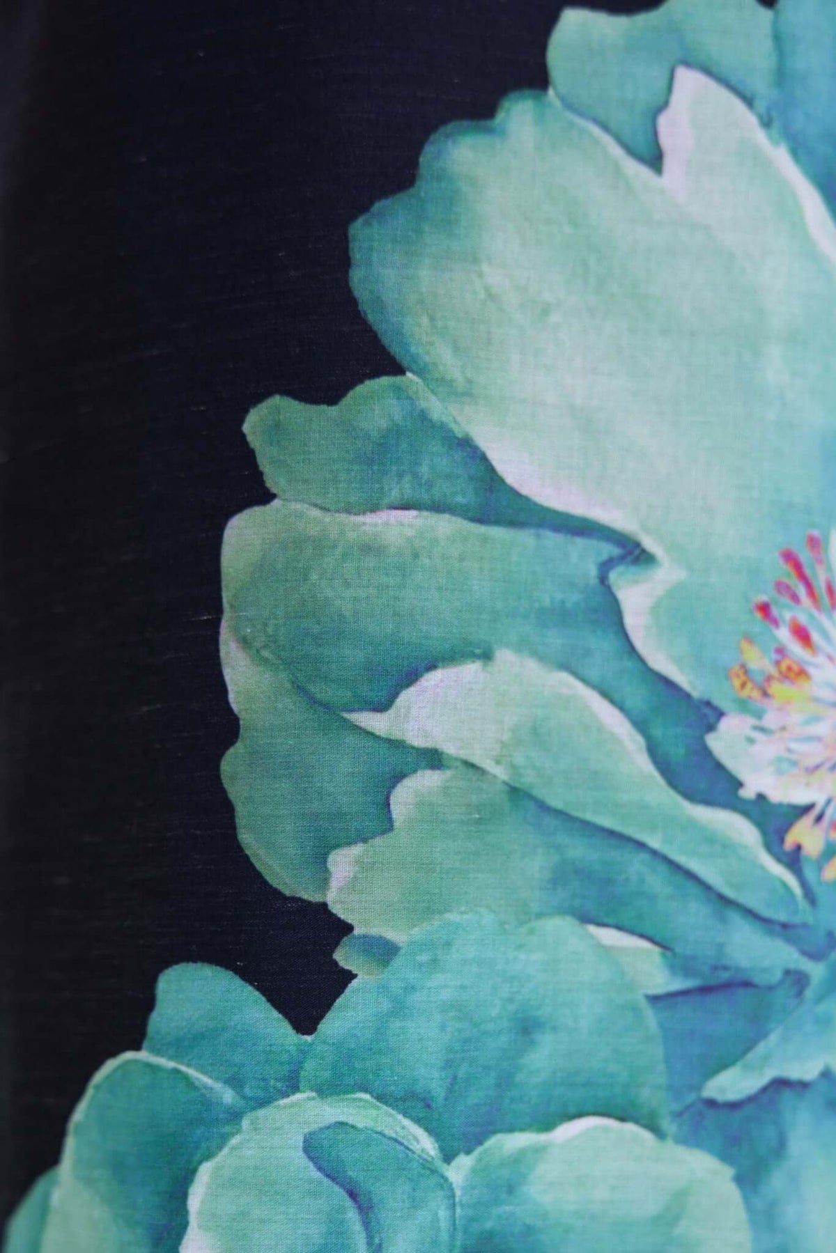Close-up of beautiful teal flowers on a dark background, showcasing vibrant floral artwork.