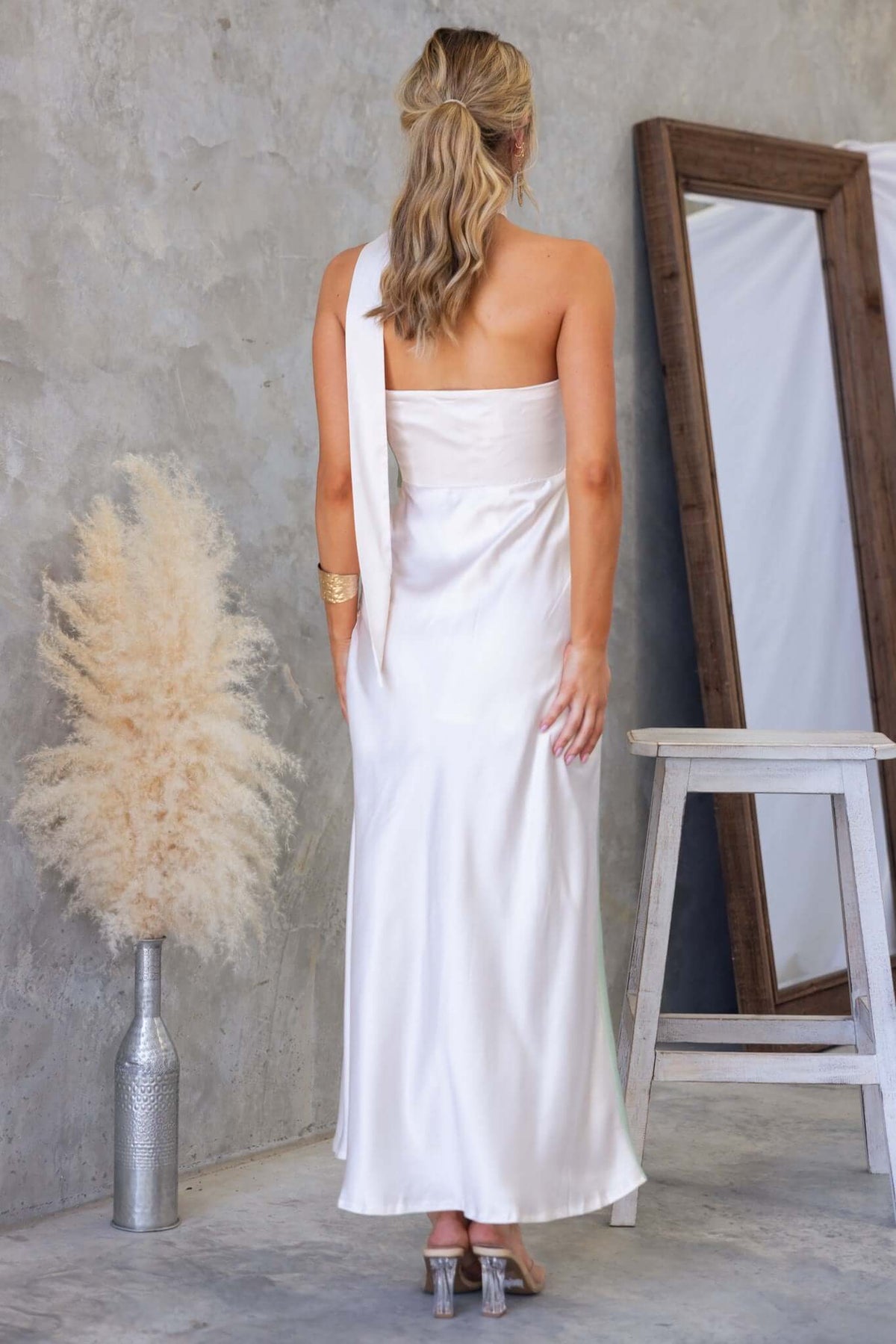 Back view of My Touch Maxi Dress, showcasing satin fabric, removable tie, and elegant floor-length design.