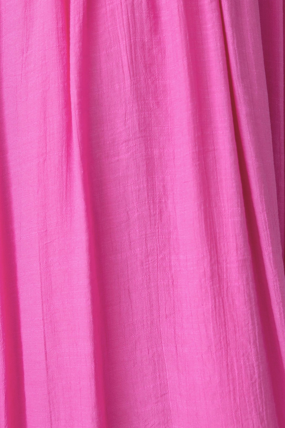 Close-up of soft pink fabric showcasing the texture of the Luciana Maxi Dress in lightweight chiffon.