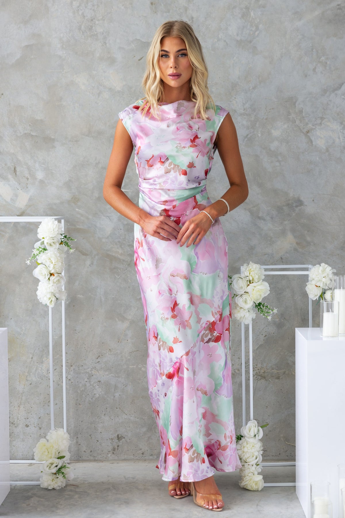 Bibi Maxi Dress featuring floral print, boat neckline, and elegant draping. Perfect for special occasions.