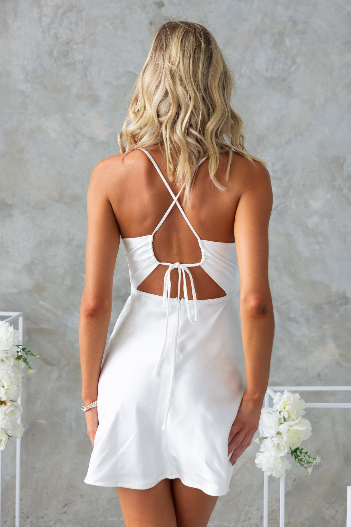 Back view of the luxurious Star Gazer Dress featuring adjustable tie straps and a stunning cut-out design.