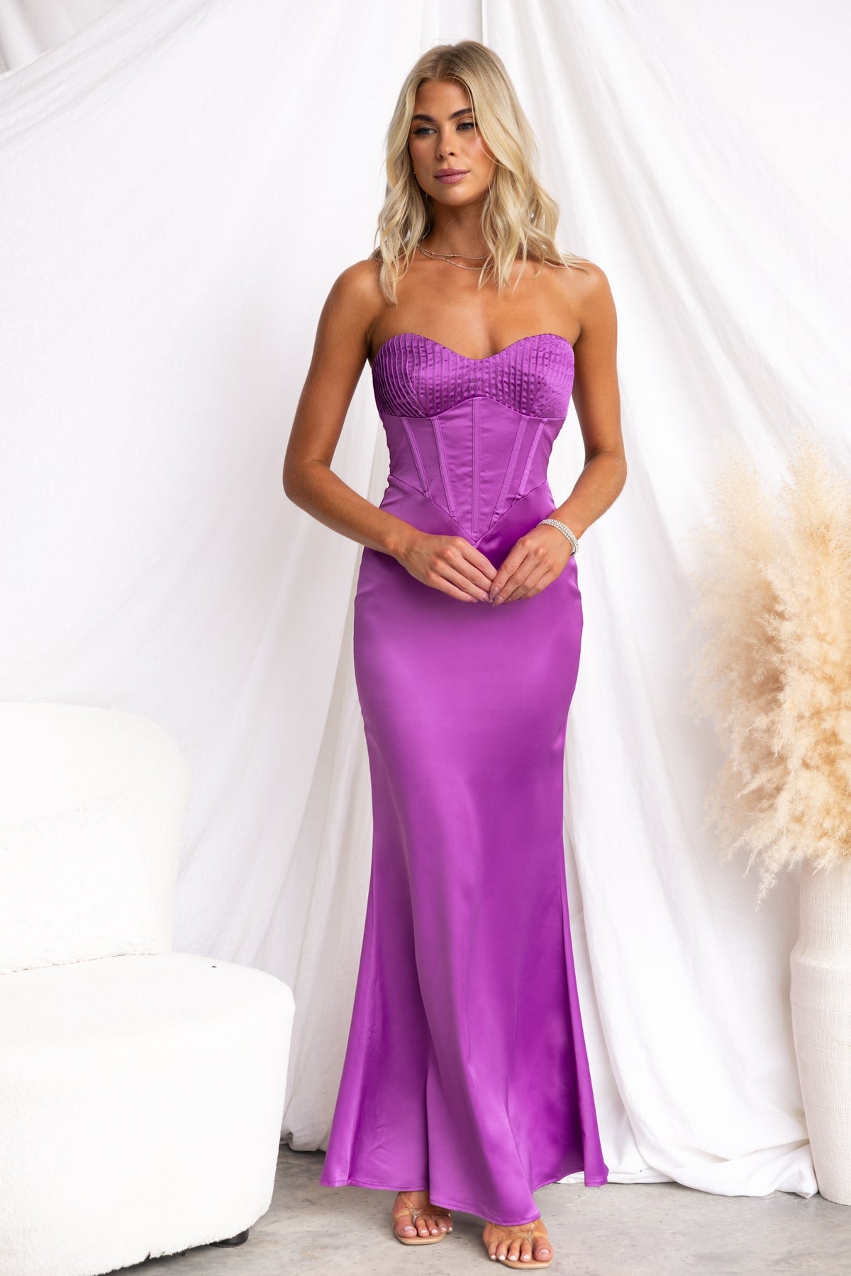 Lars Maxi Dress in vibrant purple, strapless with boning and satin finish, model wearing a size 6/XS.