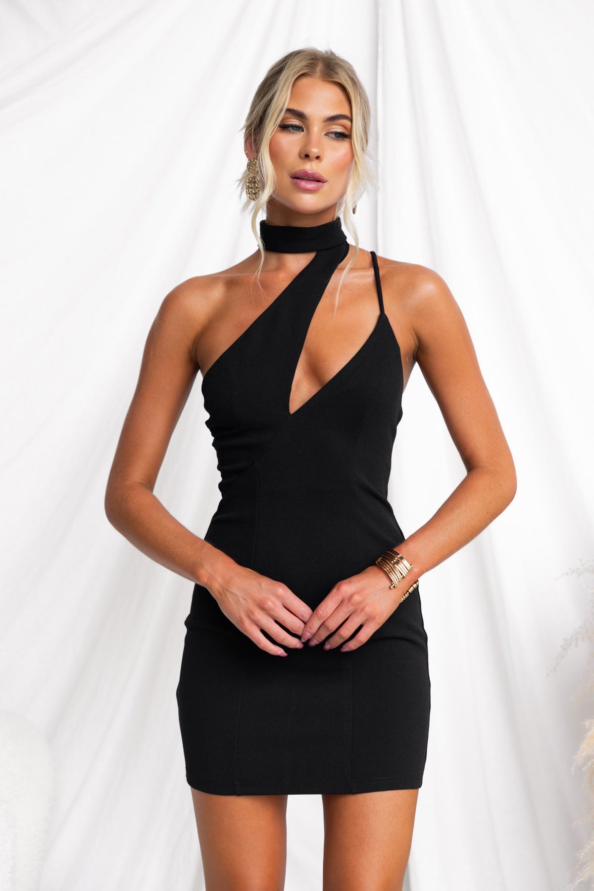 Cyndey Dress: chic black dress with high wrap neckline and adjustable strap, perfect for a stylish evening out.