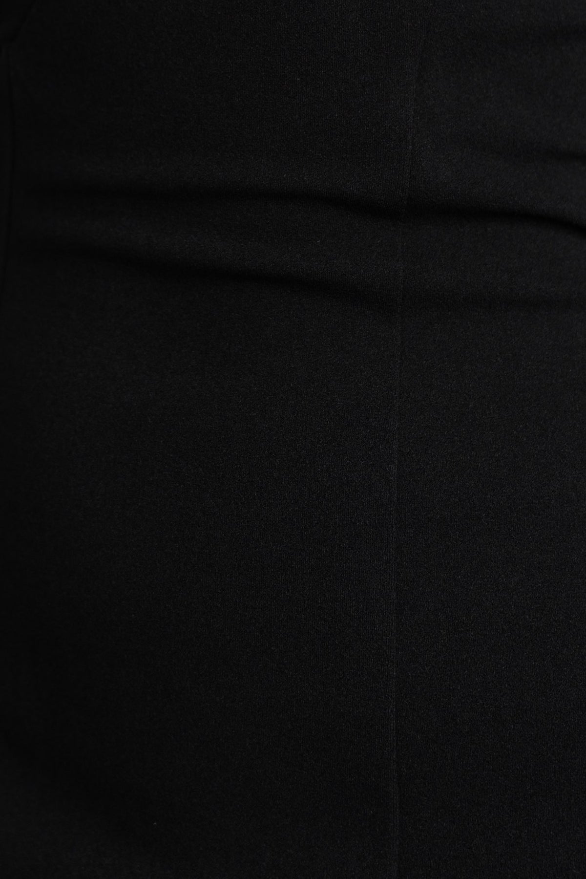 Close-up of black crepe fabric showcasing soft texture and sleek design for the Cyndey Dress.