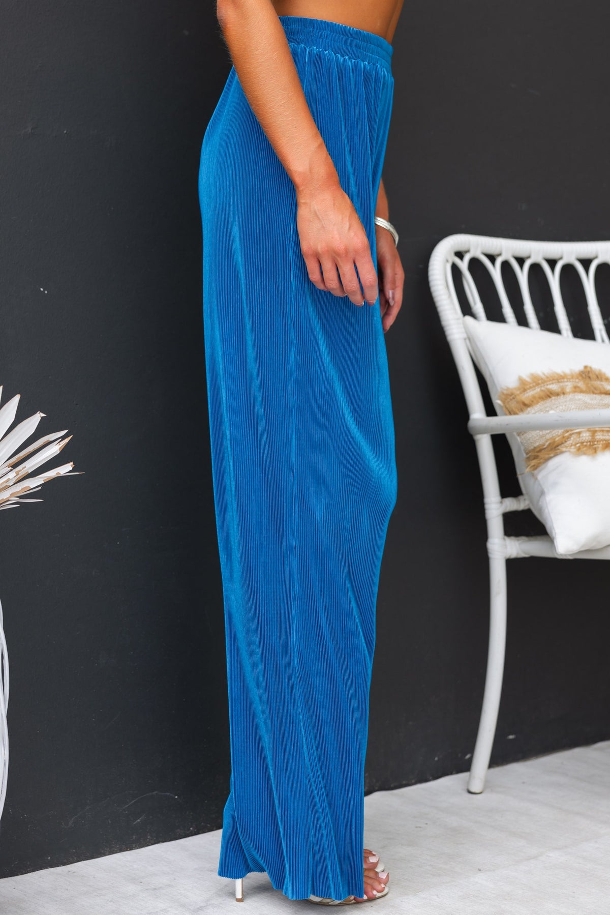 Farida Pants in vibrant blue with accordion pleat design, featuring an elastic waistband and wide leg fit.