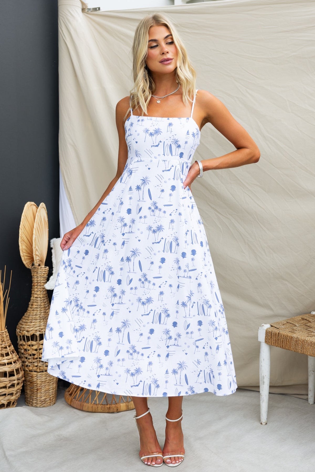 Ashia Midi Dress featuring a floral print, adjustable straps, and square neckline, perfect for summer styling.