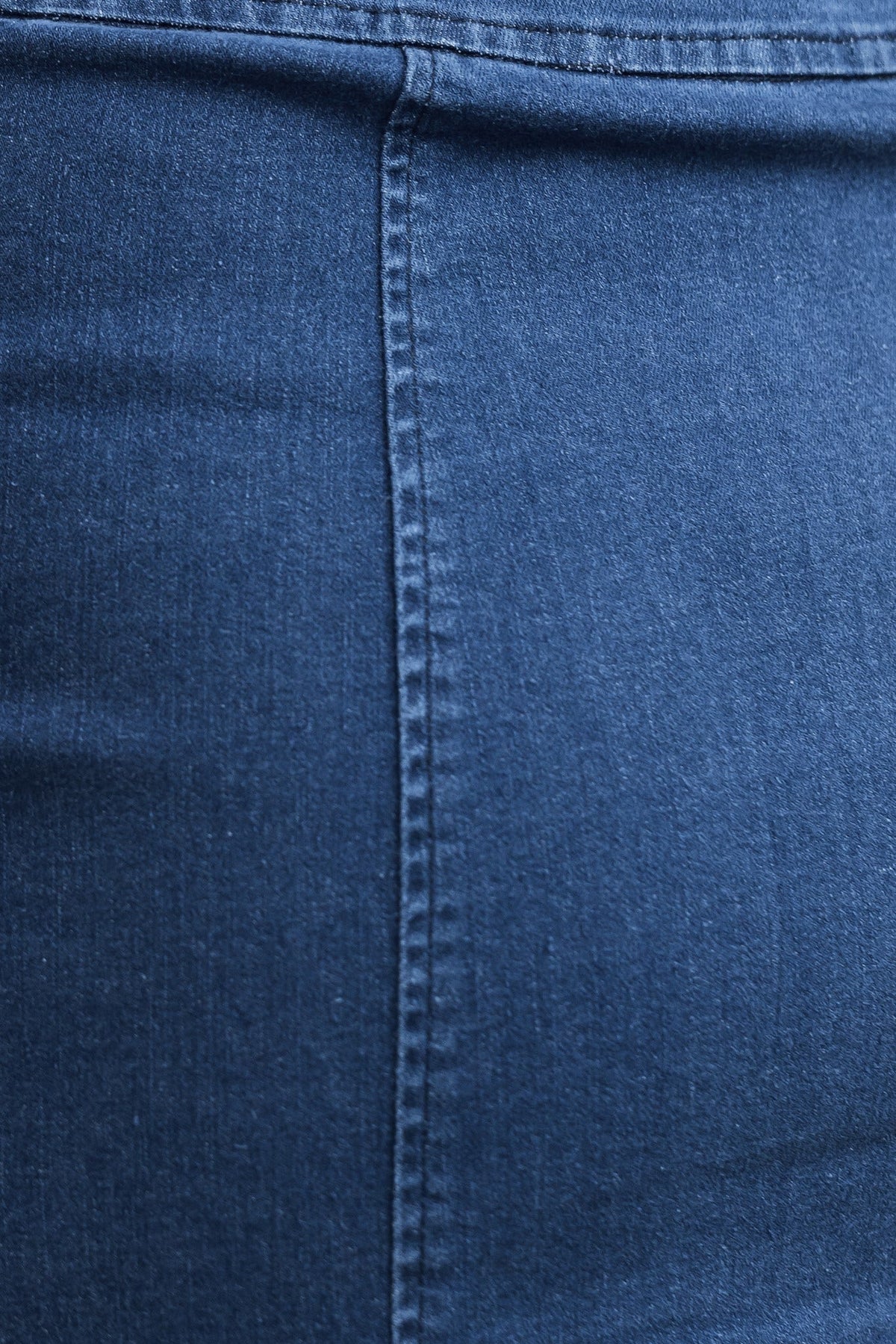 Close-up of the Sloan Denim Dress fabric, showcasing the textured denim material and seam details.