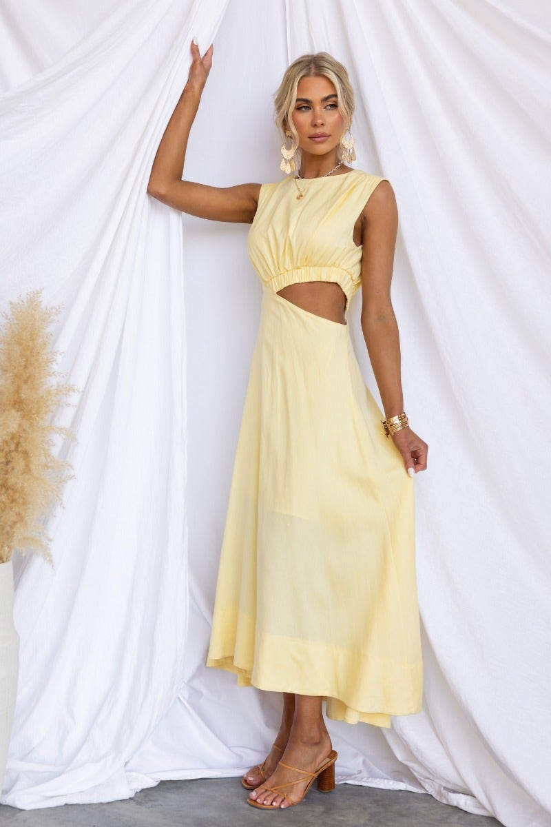 Inspire You Maxi Dress in yellow, featuring high neckline, cut-out waist, and flowy linen blend fabric.