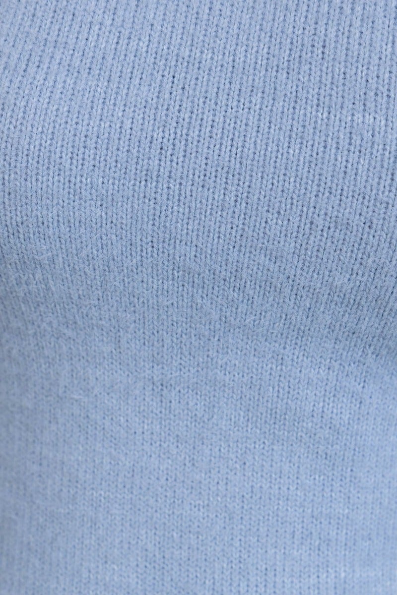 Close-up of soft blue ribbed fabric, showcasing texture and stretch for comfortable wear.