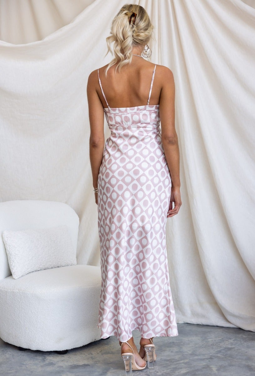 Back view of the Wishart Maxi Dress featuring adjustable straps and satin fabric with a geometric print.