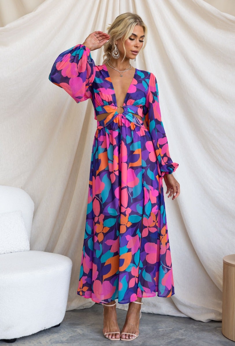 Romina Maxi Dress featuring vibrant floral print, V-neckline, and cut-out waist detail with ring.