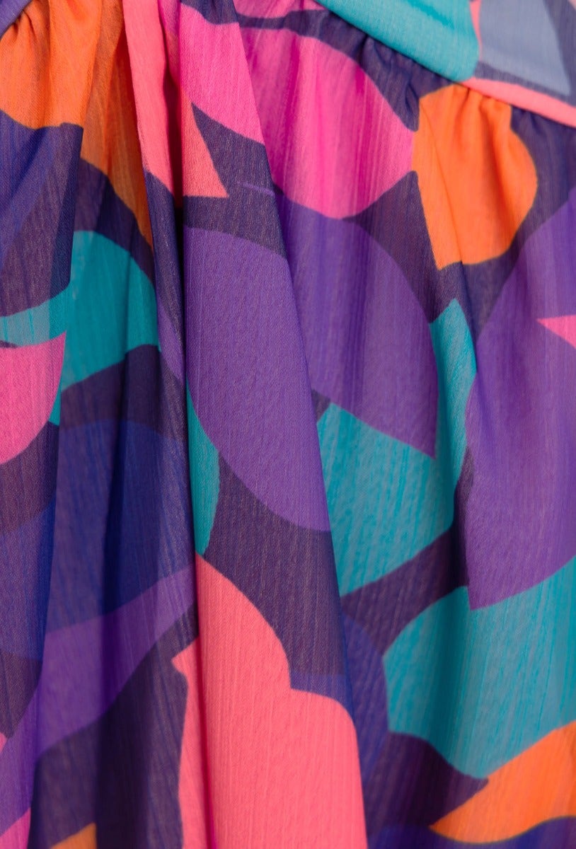 Close-up of vibrant floral print fabric in pink, purple, and teal, perfect for a Romina Maxi Dress.