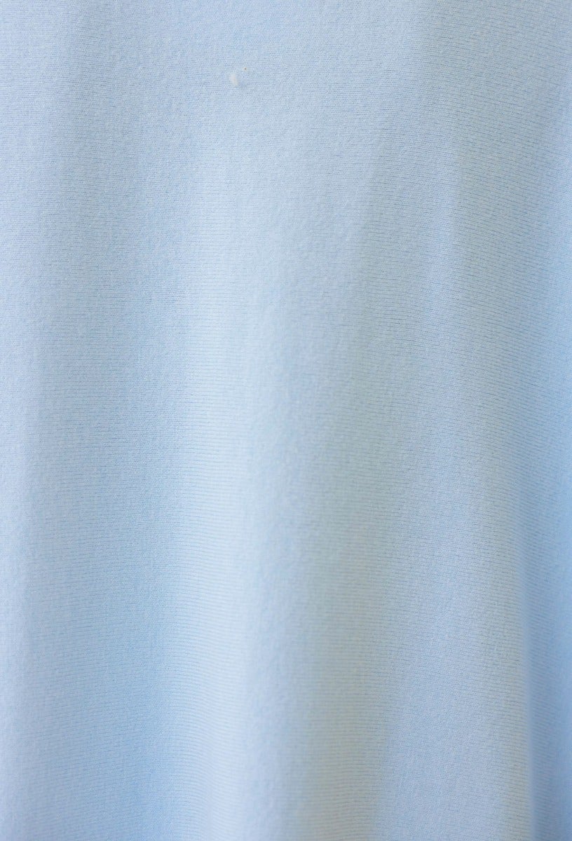 Close-up of soft, stretchable light blue fabric for the Bonnie Knit oversized top/dress.