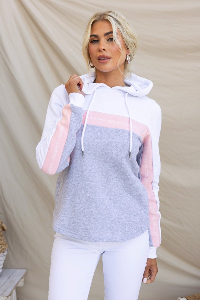 Xarles Jumper in grey and pink, featuring ribbed cuffed sleeves and drawstring hood. Model wearing size 6/XS.