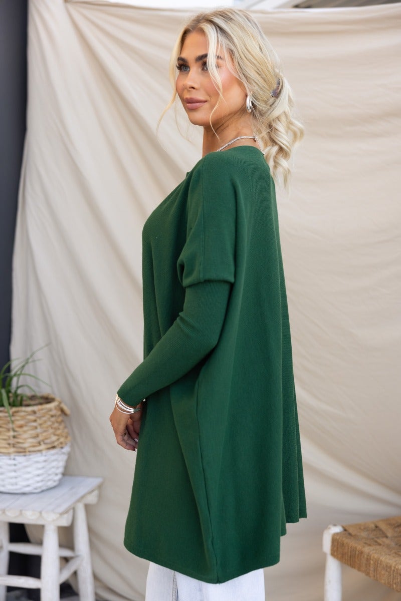 Model wearing the Bonnie Knit oversized top in green, showcasing full-length sleeves and a relaxed fit.