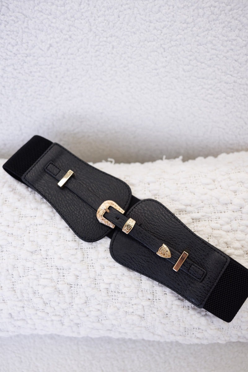 Black Madden Belt with gold hardware buckle and elastic waistband, adjustable from 70cm to 100cm.