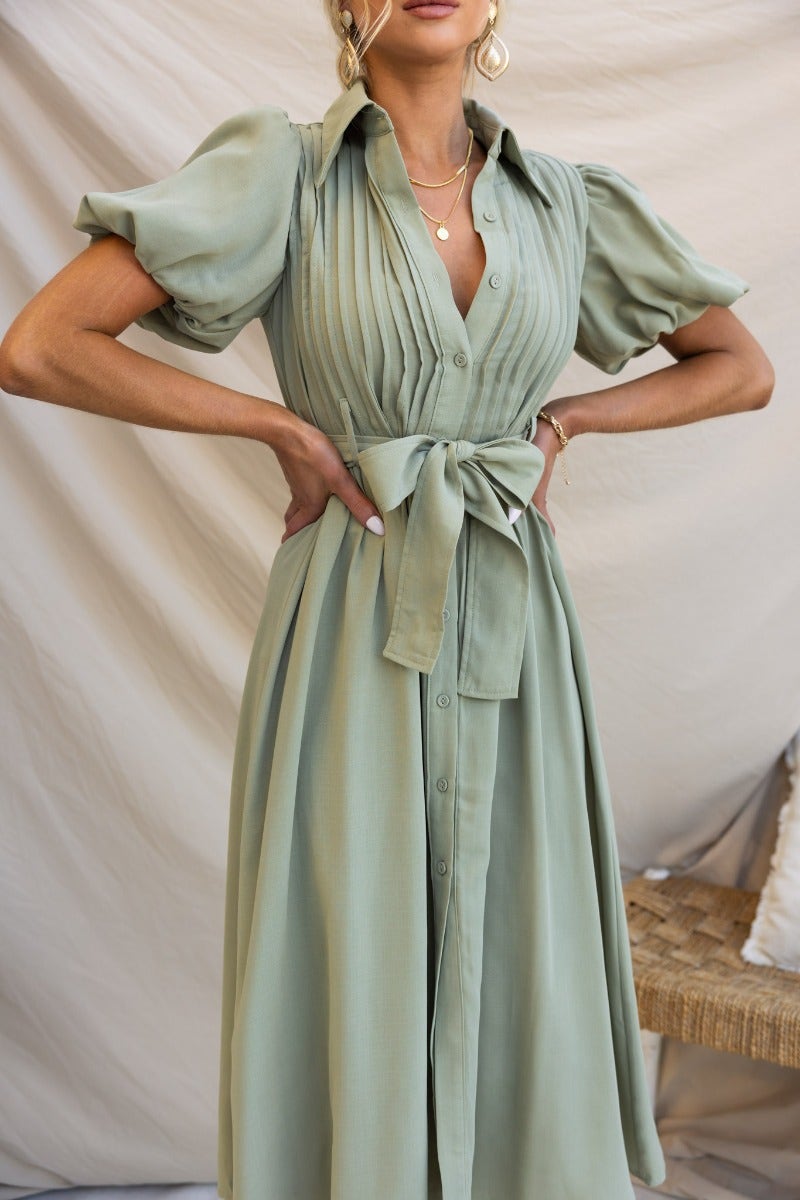 Sorrento Midi Dress in soft green with high neckline, collar, button-up front, and removable belt detail.