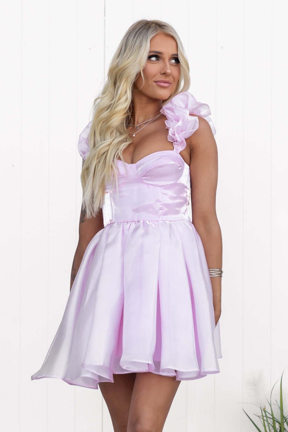 Ermia Dress features ruffle straps, an elastic back, and a flared chiffon skirt in soft pink, perfect for summer occasions.