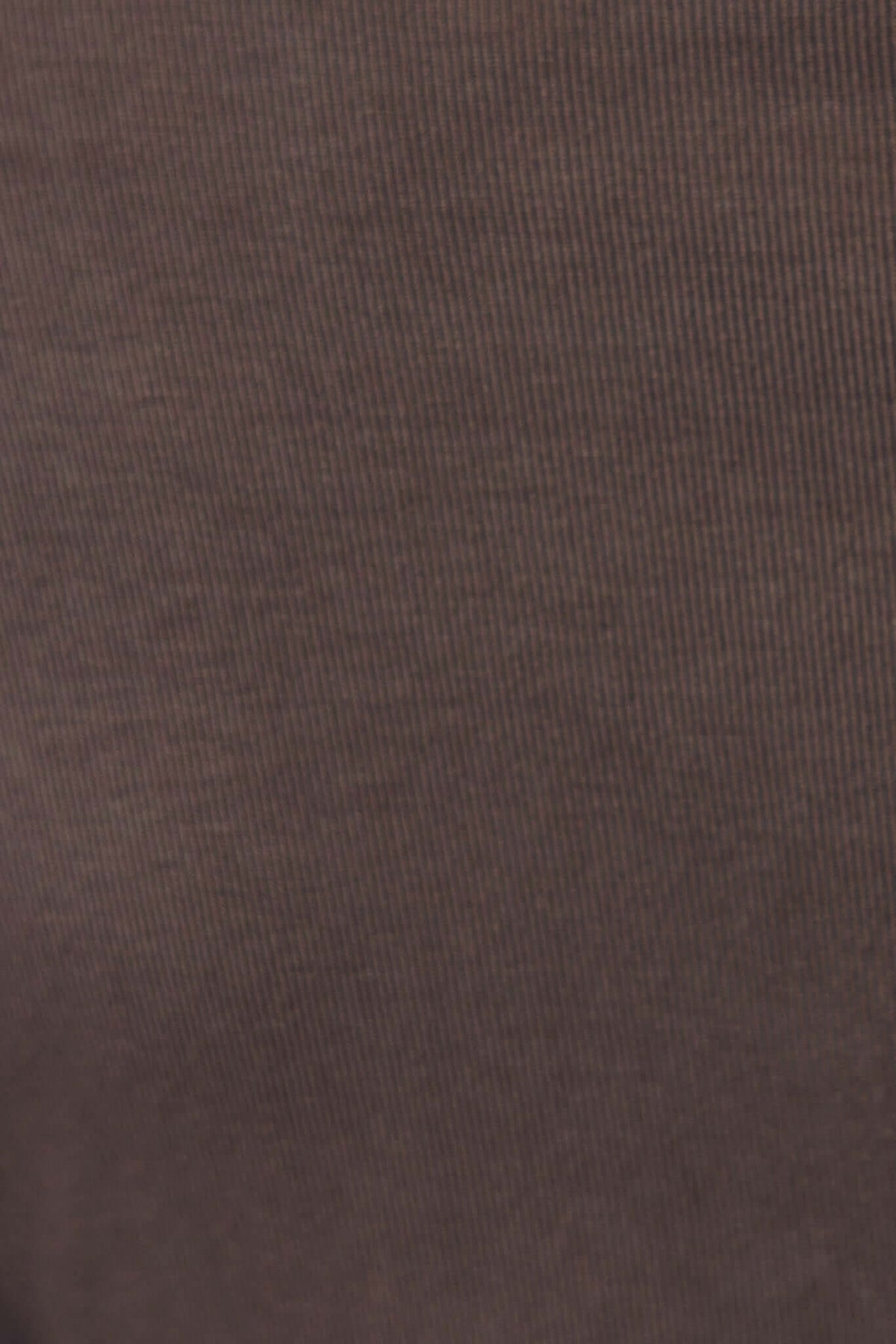 Close-up of a textured brown fabric showcasing its ribbed detail, ideal for stylish and comfortable tops.