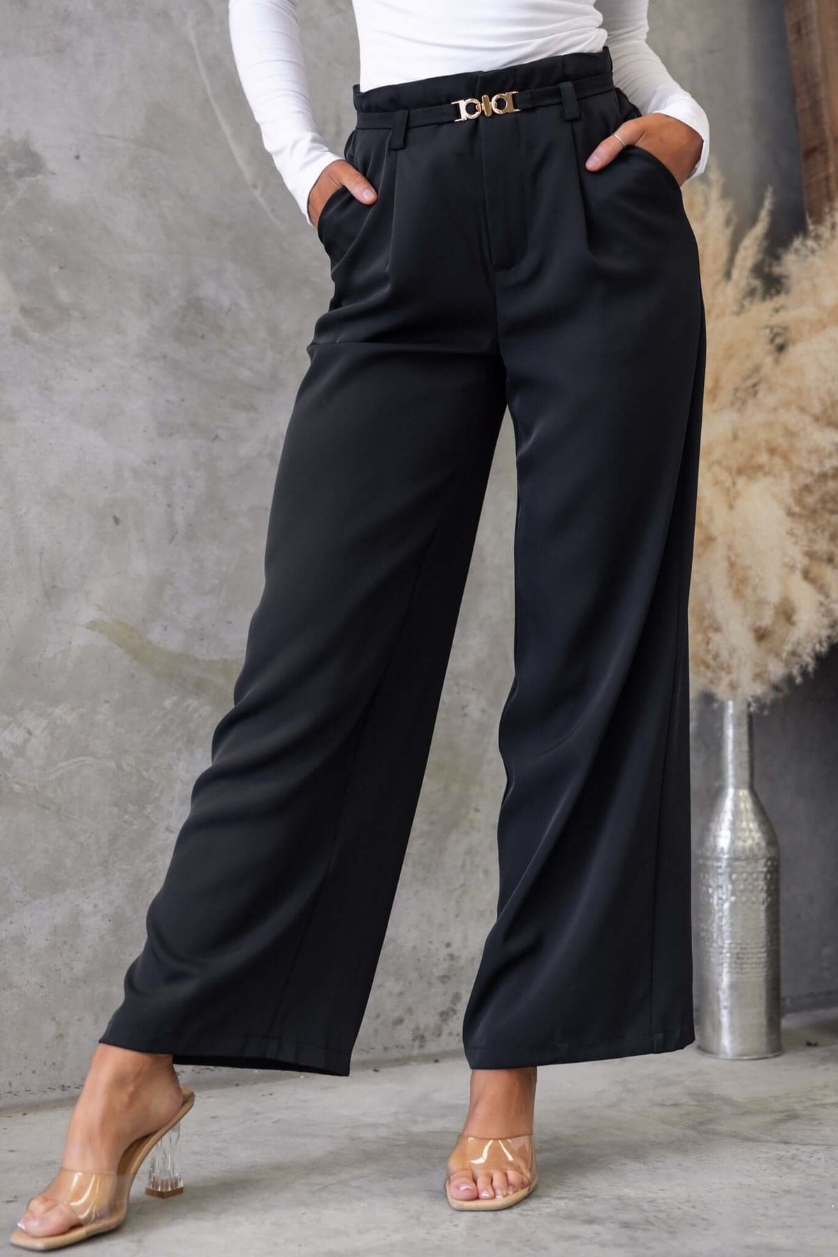 Hammond Pants in black featuring a mid-high waist, removable belt, and pockets, styled with a white top.