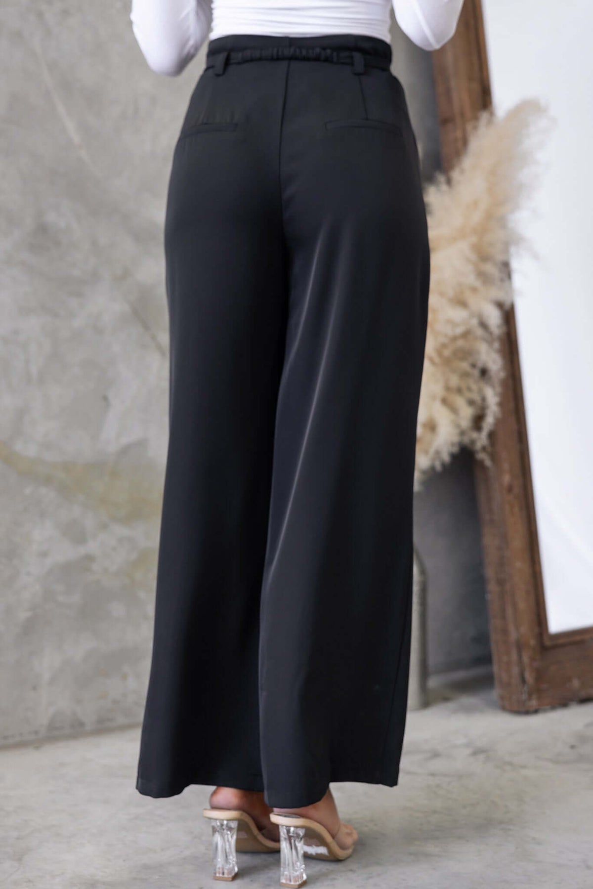 Hammond Pants: black mid-high waist pants with removable belt, pockets, and a relaxed fit.