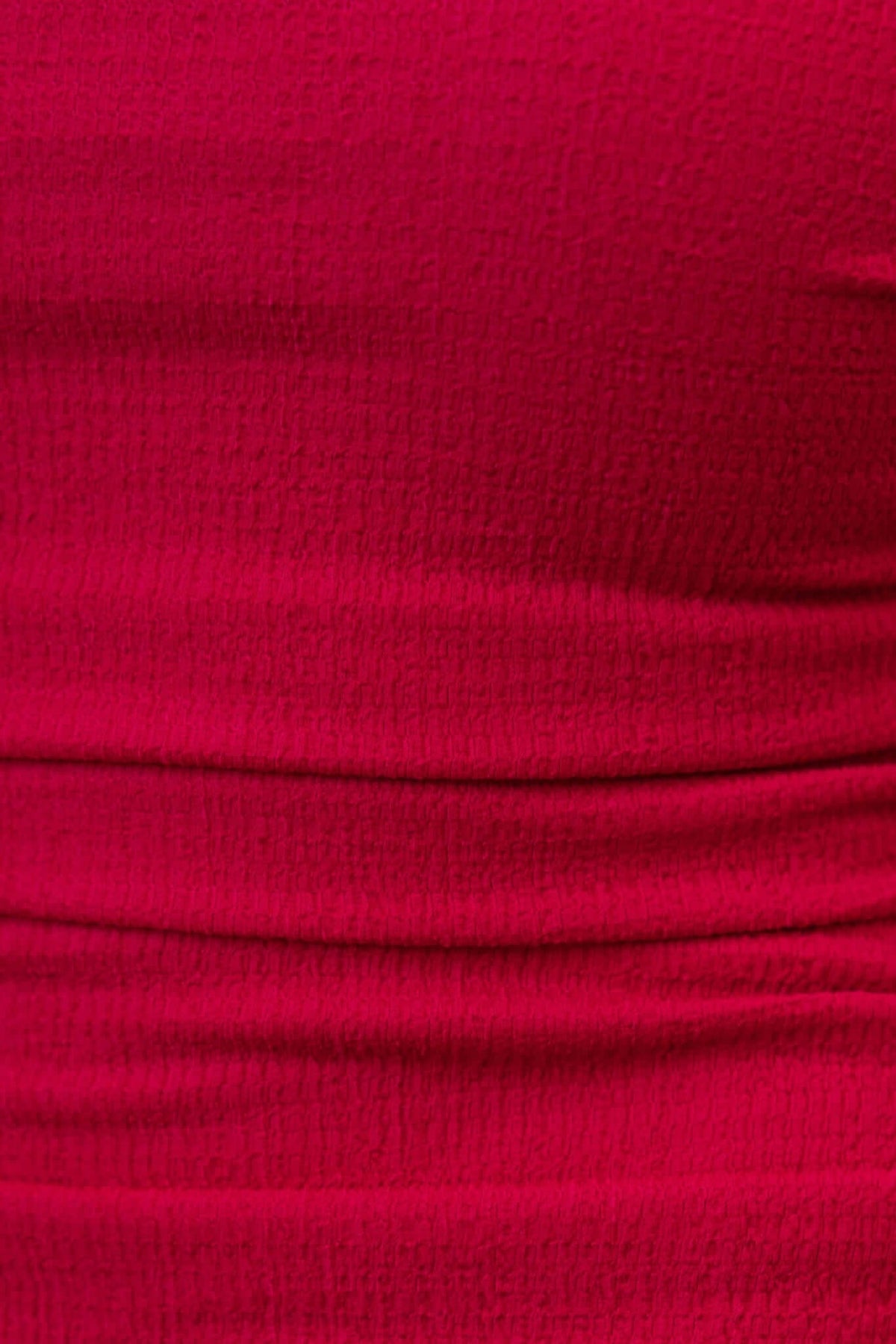 Close-up of textured fabric in vibrant pink, showcasing ruching detail for Topeka Midi Dress.