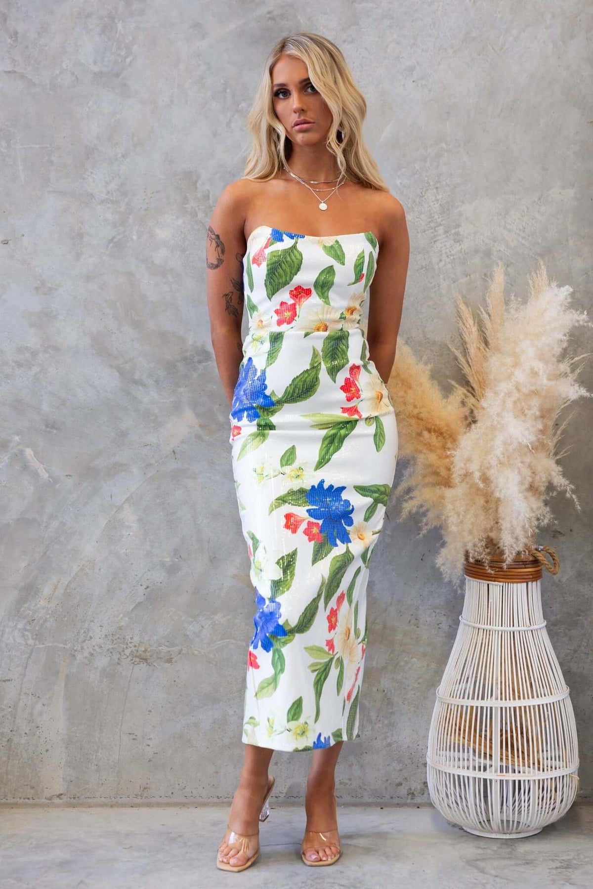 Frutta Maxi Dress with floral print, strapless design, high split, and sequins, model wearing size 6/XS.