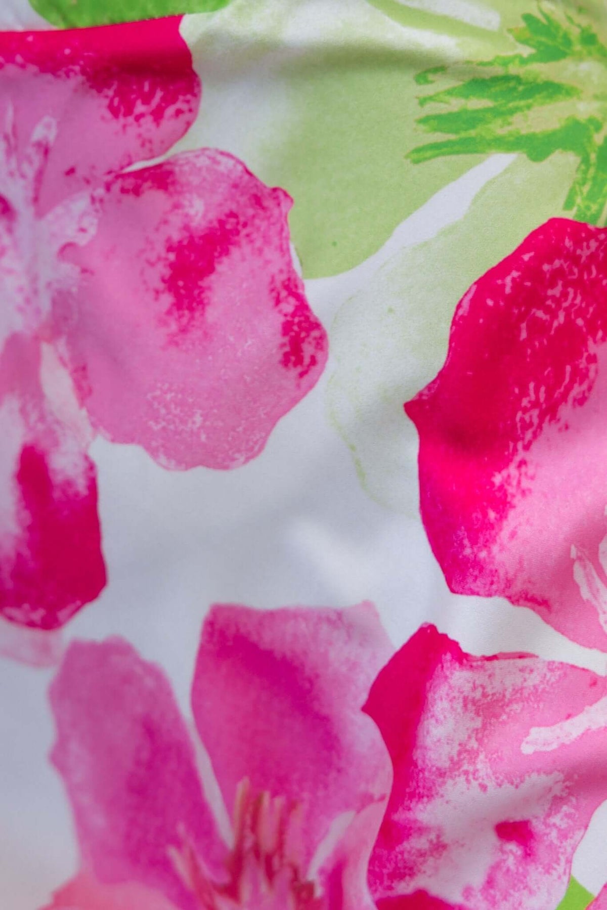 Close-up of pink floral design on satin fabric for the Forbidden Love Maxi Dress.