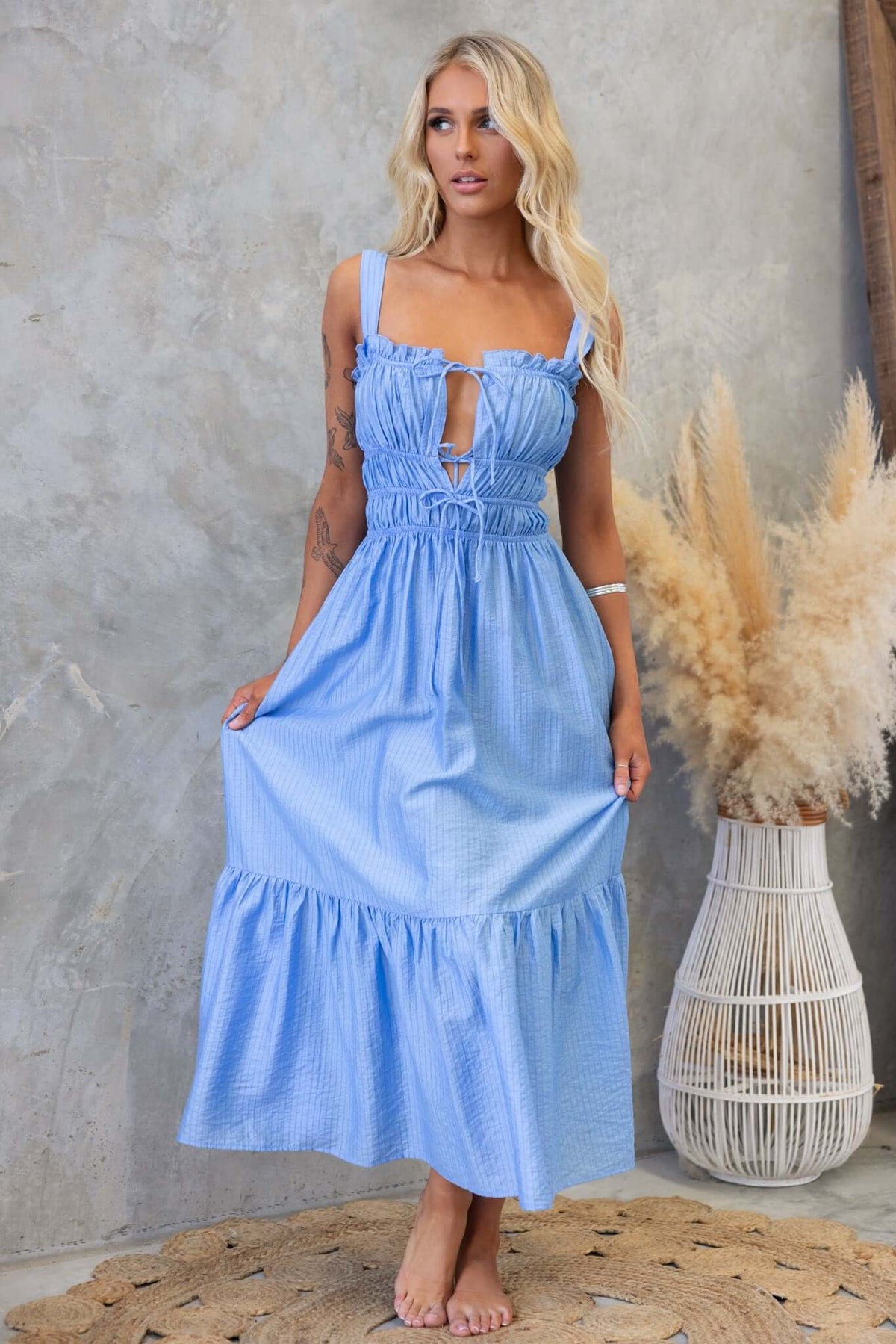 Shanina Midi Dress in light blue with tie bust details and textured fabric, perfect for casual or summer occasions.