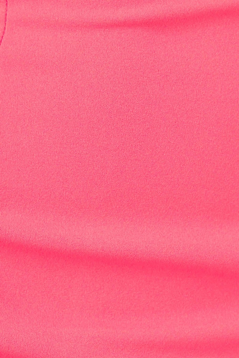 Close-up of soft, smooth fabric in vibrant pink, showcasing its stretch and texture for the Stazi Maxi Dress.