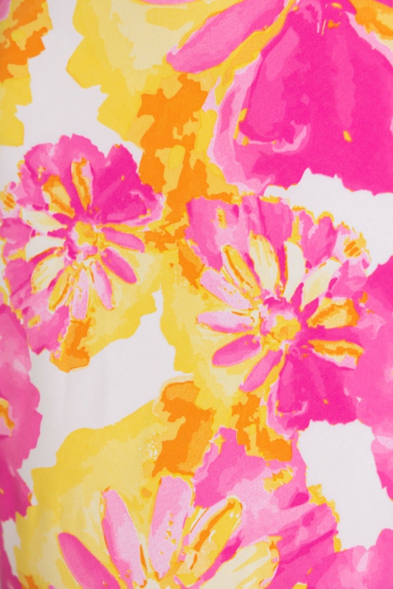 Vibrant floral print featuring pink and yellow flowers on a white background for a summer maxi dress.