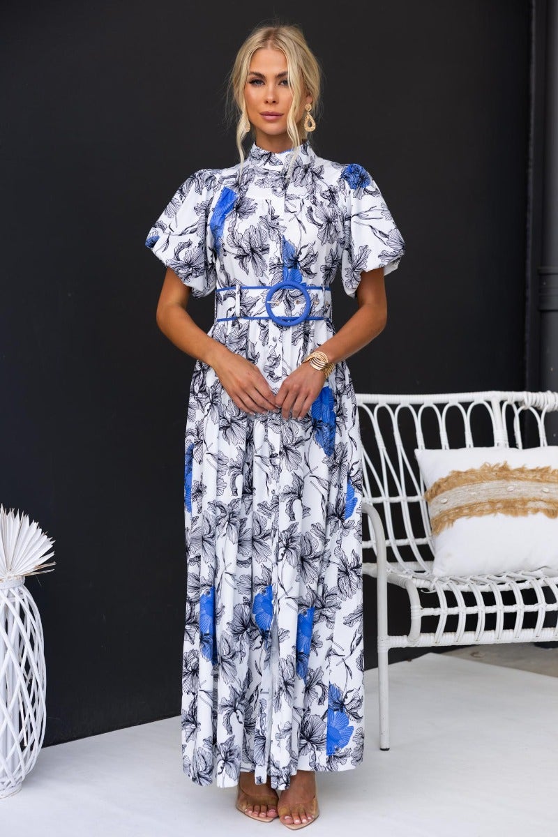 Floral print Younger Now maxi dress with high neckline, button-up front, and removable belt, styled with elegant accessories.