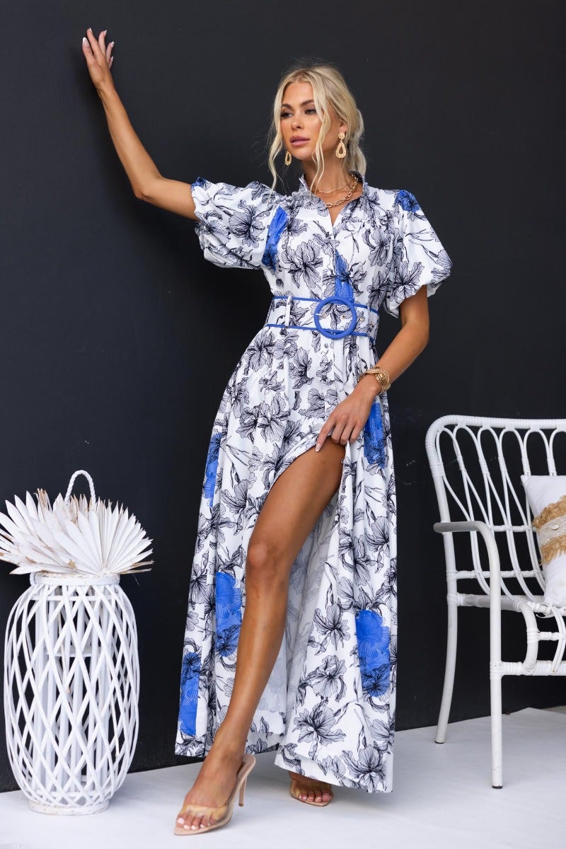 Floral print Younger Now maxi dress with button-up front, high neckline, and removable belt. Model poses confidently.