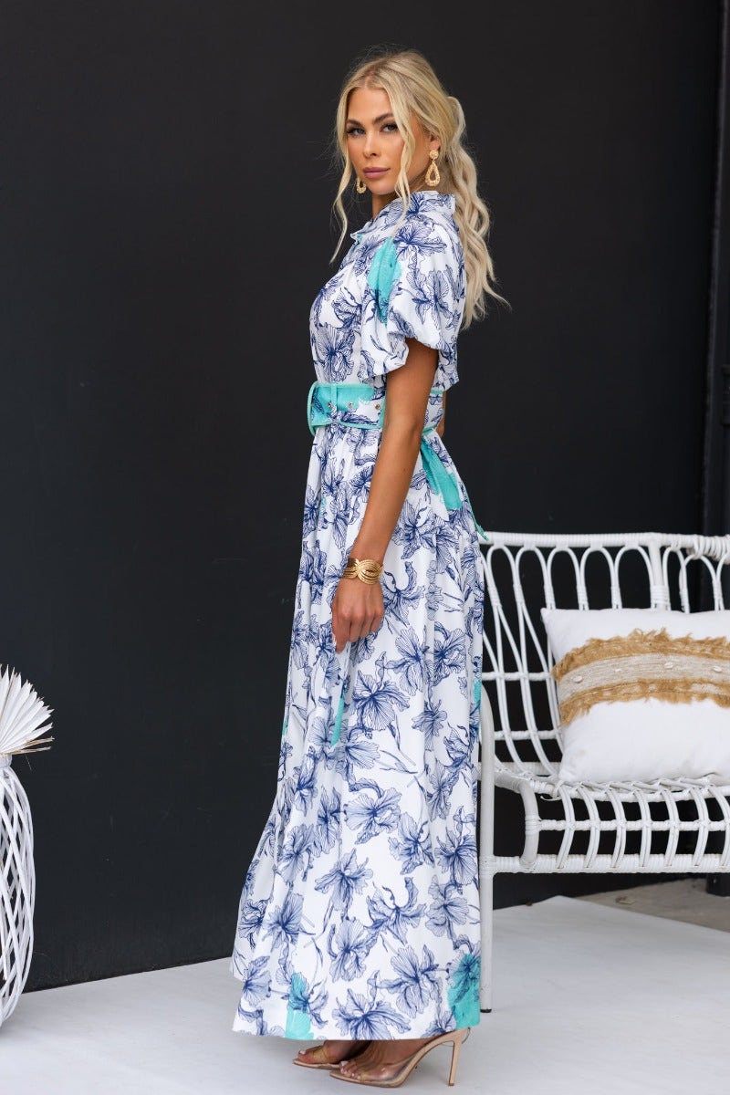 Younger Now Maxi Dress in floral print, featuring a high neckline, button-up front, and an elastic waistband.