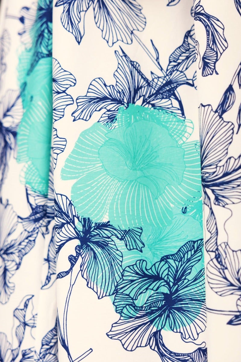 Floral print design featuring blue and teal flowers against a light background, perfect for a maxi dress.