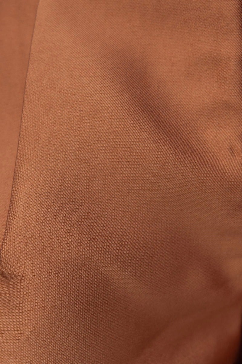Close-up of soft, sheen fabric in warm brown color, ideal for Virginia shorts with a mid-high waist fit.