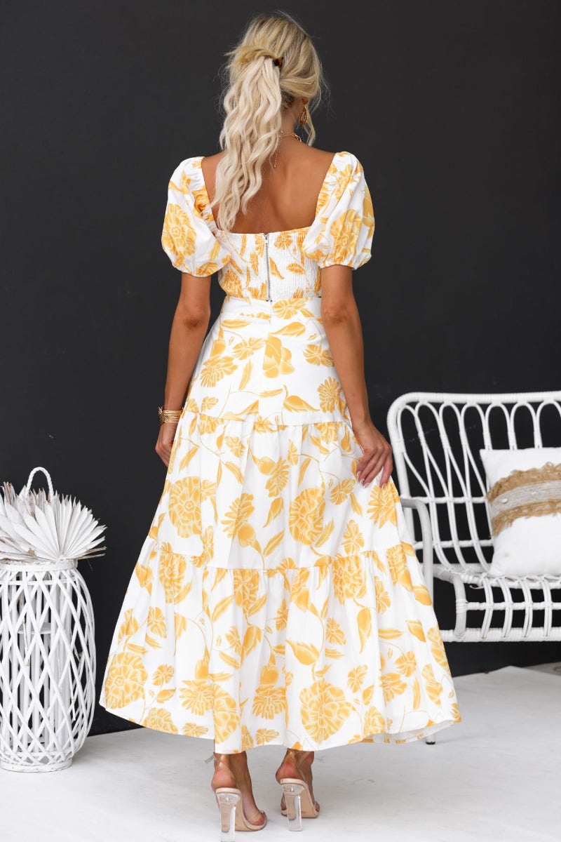 Back view of the Somebody To Love floral print set featuring a lined maxi skirt and puff sleeves.