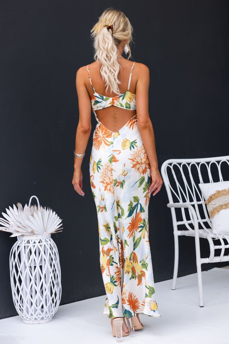 Stylish back view of Disappear Maxi Dress featuring floral print and cut-out design, perfect for summer fashion.