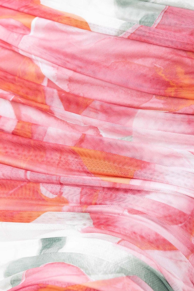 Close-up of the colorful mesh overlay fabric of the Dayara Midi Dress featuring a floral design.