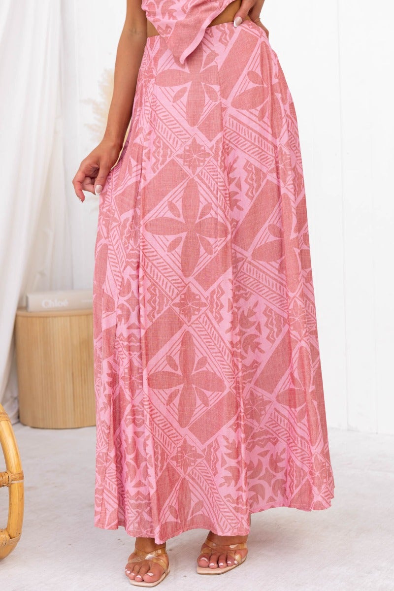 Kona Maxi Skirt in pink with intricate patterns, featuring a mid-high waist and elegant floor-length design.