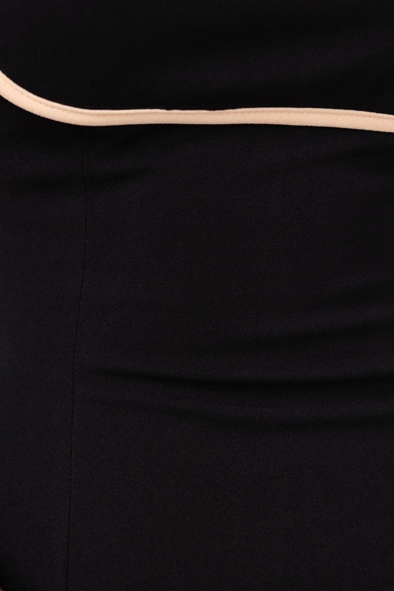 Close-up of the black Stazi Maxi Dress, featuring a contrasting strap detail and smooth fitted fabric.
