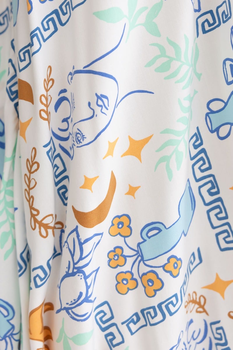 Abstract print fabric featuring floral and decorative designs in pastel colors for Relly Maxi Dress.