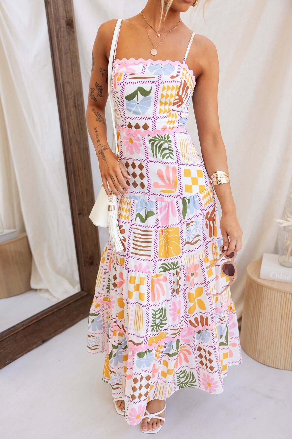 Colorful Miffy maxi dress with adjustable straps and tiered skirt, perfect for summer fashion.