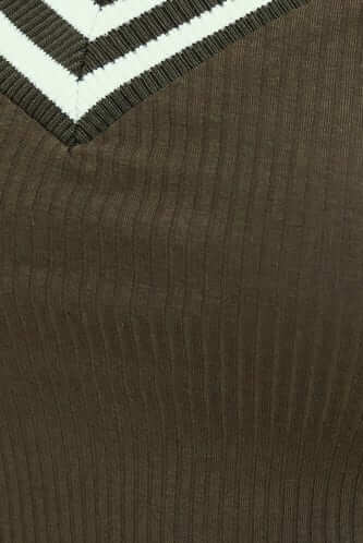Close-up of Harford Top showing V-neckline and ribbed olive green fabric.