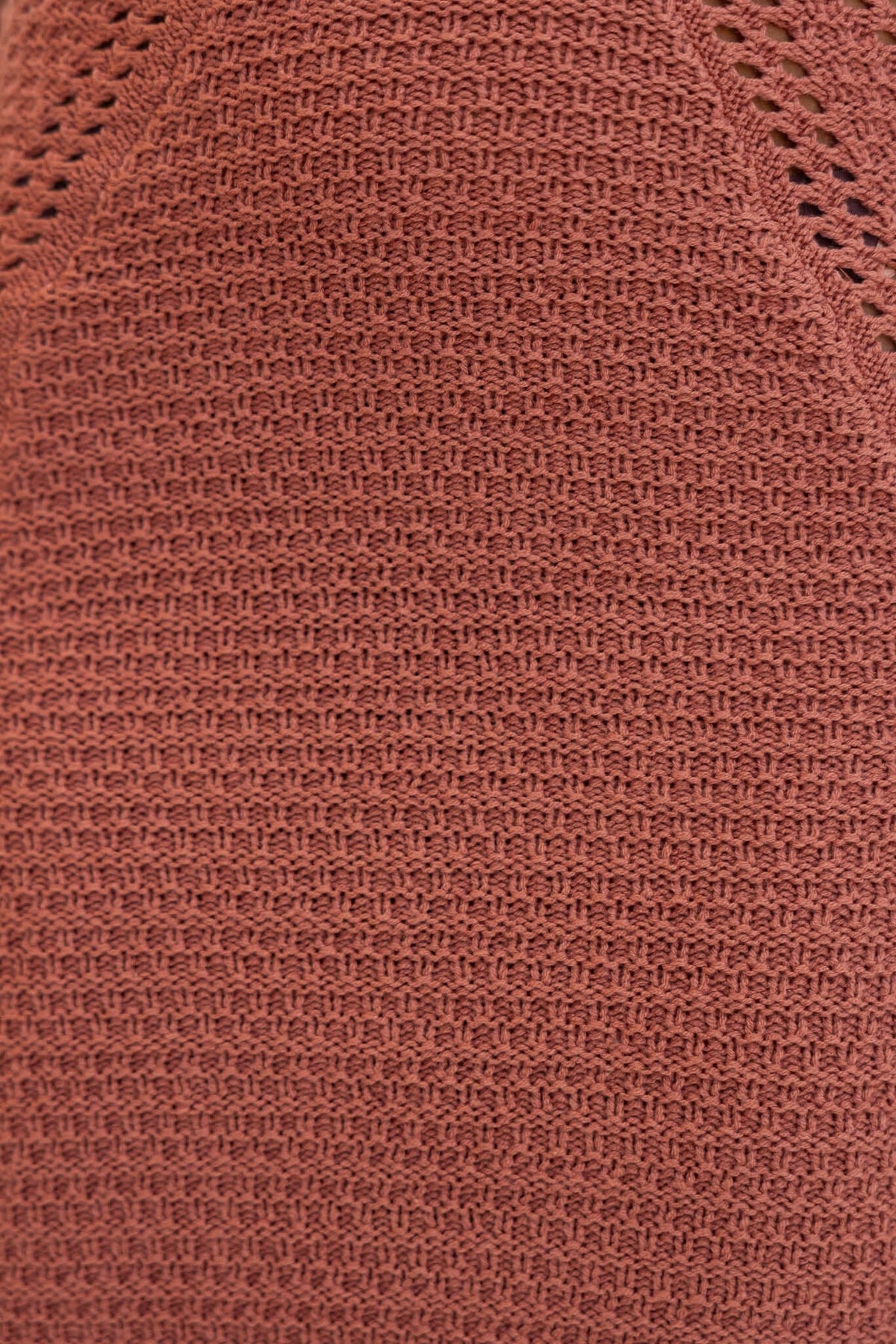 Close-up view of textured crochet fabric in warm brown, showcasing the intricate knit pattern of the Hold Up Maxi Dress.