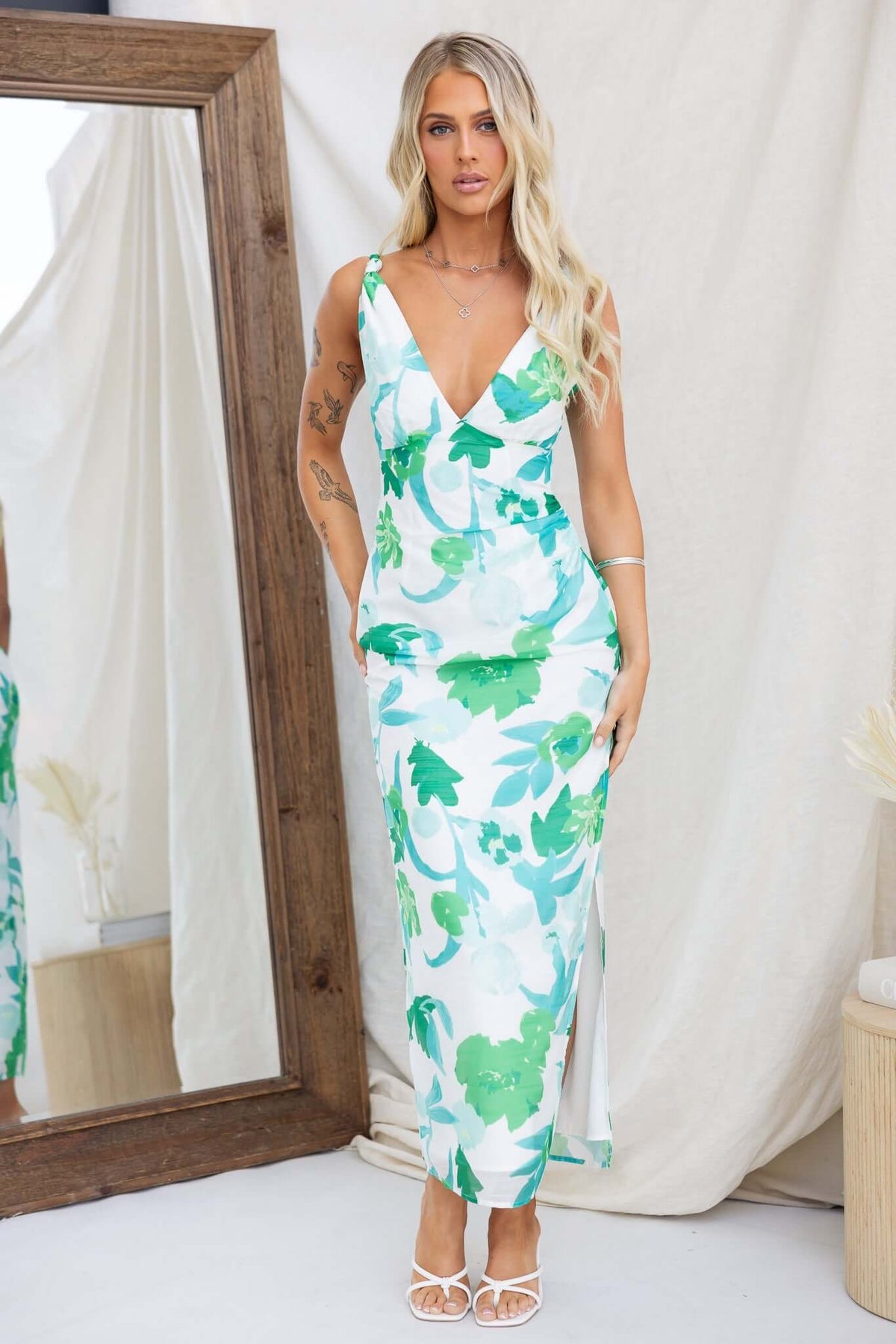 Riverside Maxi Dress featuring twist straps and side split, perfect for summer outings, styled with sandals.