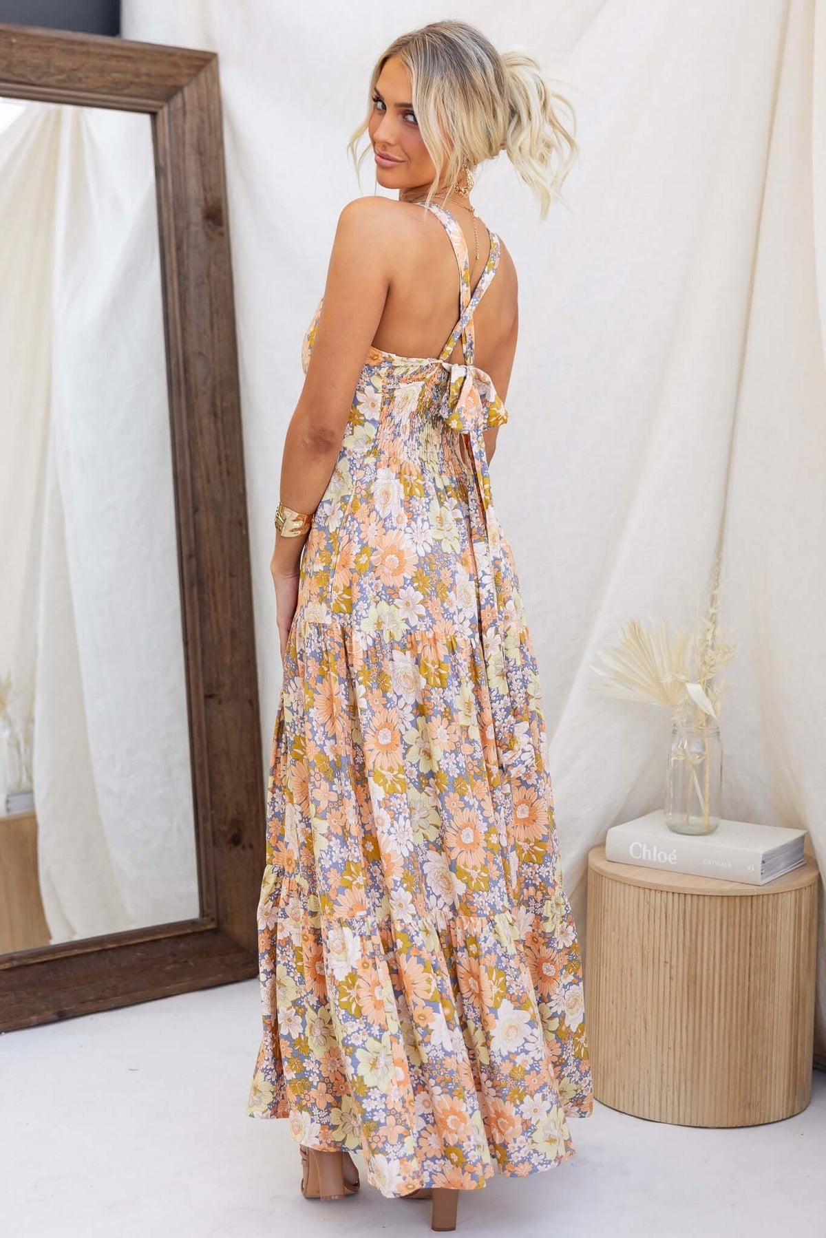 Etsie Maxi Dress features a floral print, tie halter neckline, and back elastic, perfect for a breezy summer look.