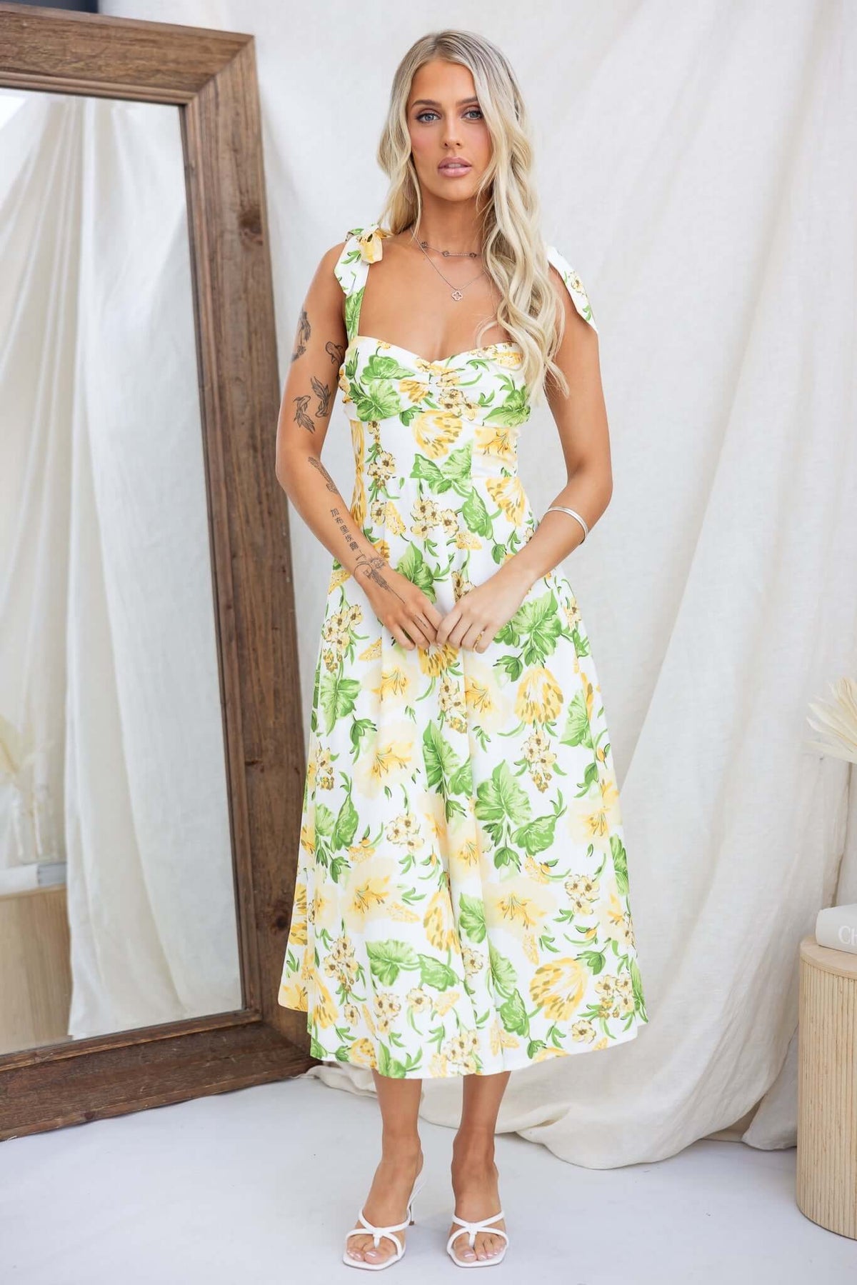 Floral print midi dress with adjustable tie straps and invisible zip, model wearing size 6/XS.