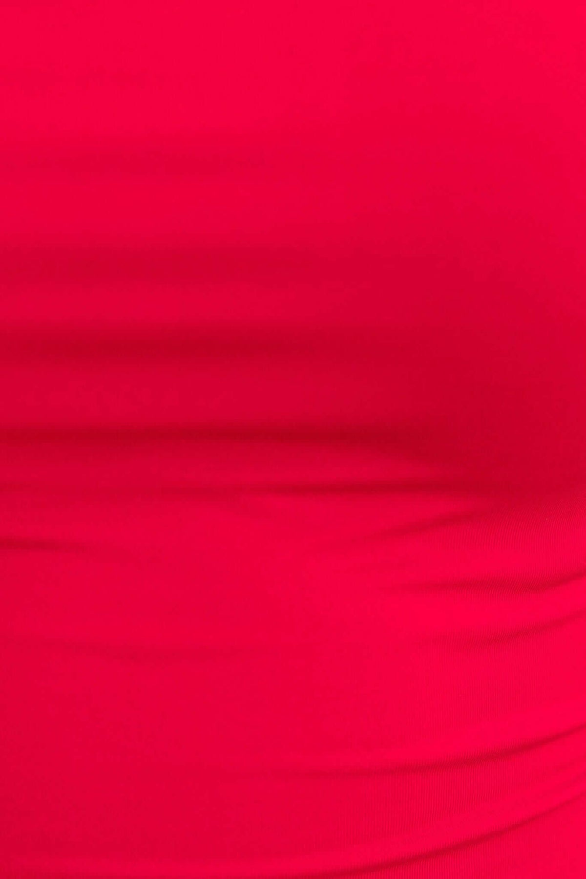 Close-up of the Brea Bodysuit in vibrant pink with stretch fabric, highlighting its smooth texture and fitted design.